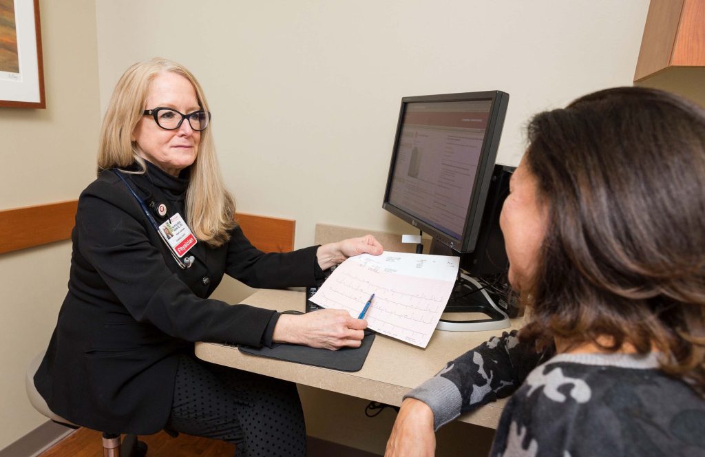 Dr. Heintz consults with patient.