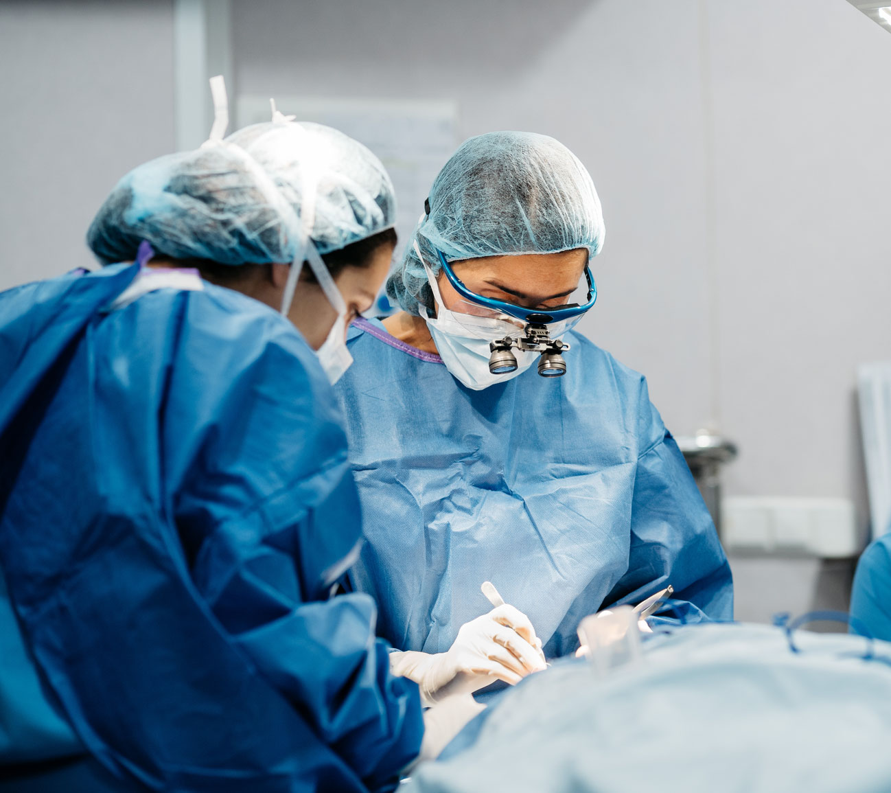 Surgeons performing surgery.