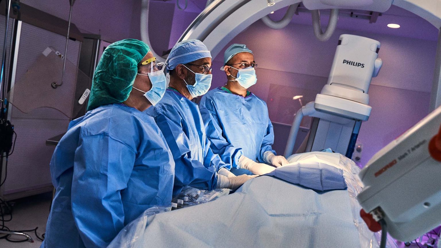 Cooper and Inspira Cardiac Care doctors performing surgery in OR.