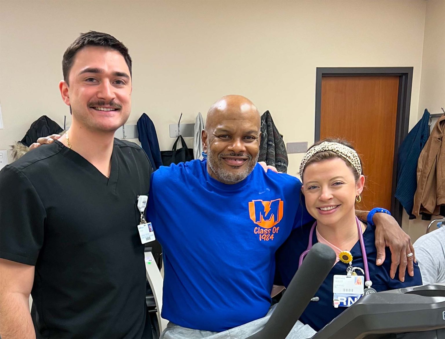 Marlin smiling with Ethan and Ashley.